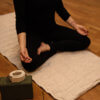 hemp padded yoga mat with person sitting