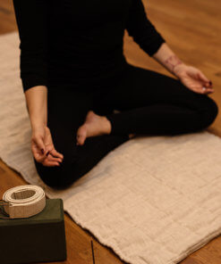 hemp padded yoga mat with person sitting